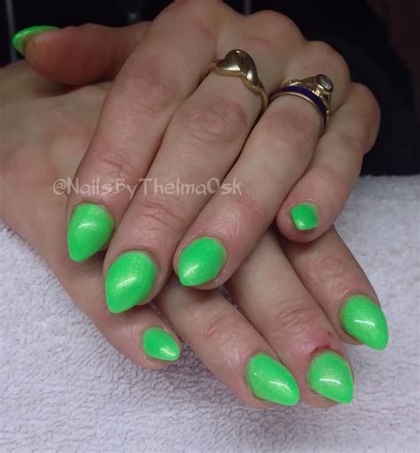 Gorgeous playful st patty's day vibed nails! Green with golden shimmer