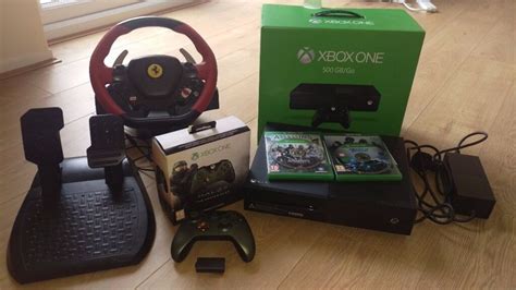 Xbox one racing steering wheel controller thrustmaster ferrari video game pedals. Xbox One 500GB bundle. Halo5 controller, Ferrari steering wheel, Assassins Creed, Need for Speed ...