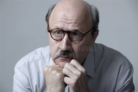Head Portrait Of Senior Mature Old Man On His 60s Looking Sad And