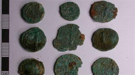 English Men With Metal Detectors Discover Roman Coin Hoard In Farmers Field Mental Floss