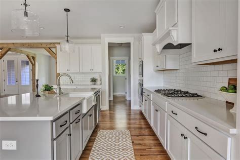 For example, the stark contrast between antique white shaker kitchen cabinets. OPEN KITCHEN WITH WHITE SHAKER CABINETS, GRAY ISLAND ...