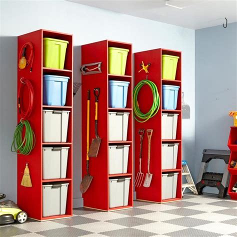 Three Red Storage Cabinets Filled With Different Types Of Tools And