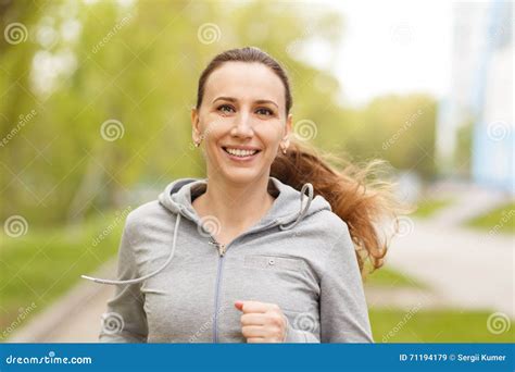 Young Smiling Woman Jogging In Park In The Morning Stock Image Image