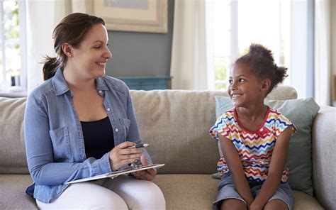 Young Girl Talking With Counselor At Home Effective Child Therapy