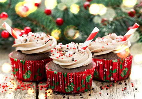 Dark chocolate is melted and combined with peppermint extract and then drizzled with both milk and white chocolate. Christmas And New Year Cupcakes - Chocolate Cakes With ...