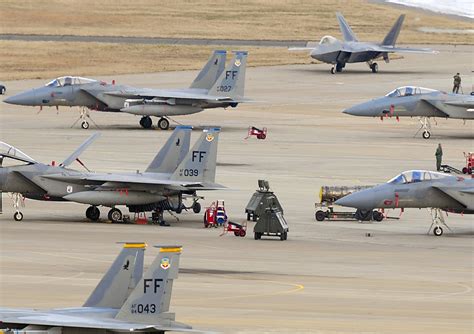 A Us Air Force Fa 22 Raptor Fighter Aircraft Top Right Taxis On