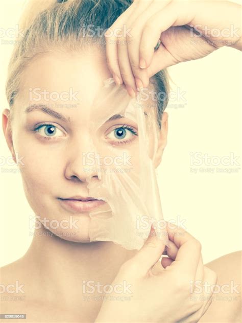 Girl Removing Facial Peel Off Mask Stock Photo Download Image Now
