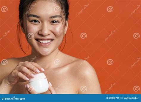 Image Of Smiling Shirtless Asian Girl Posing With Facial Cream Stock Image Image Of Asian