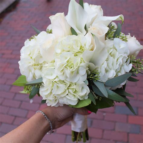 gorgeous bridal bouquet featuring white lilies roses and hydrangea centralsquareflo