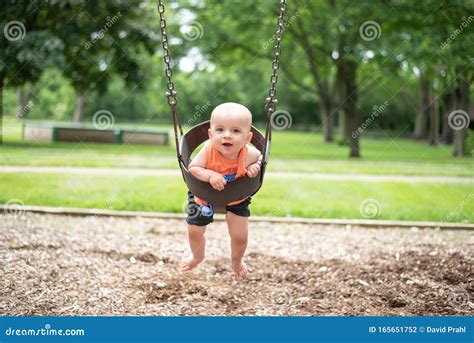 Baby On Swing In Park Stock Photo Image Of Happy Laughing 165651752