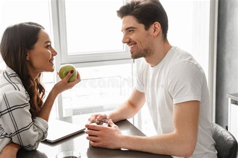 Image Of Attractive Man And Woman Looking At Each Other While S Stock