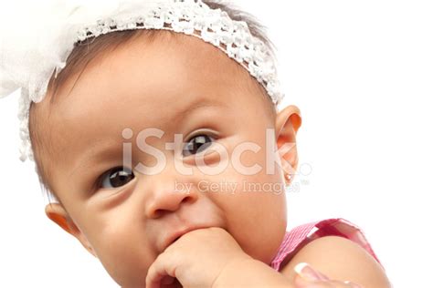 Cute Baby Girl Biting On Her Hand Stock Photo Royalty Free Freeimages