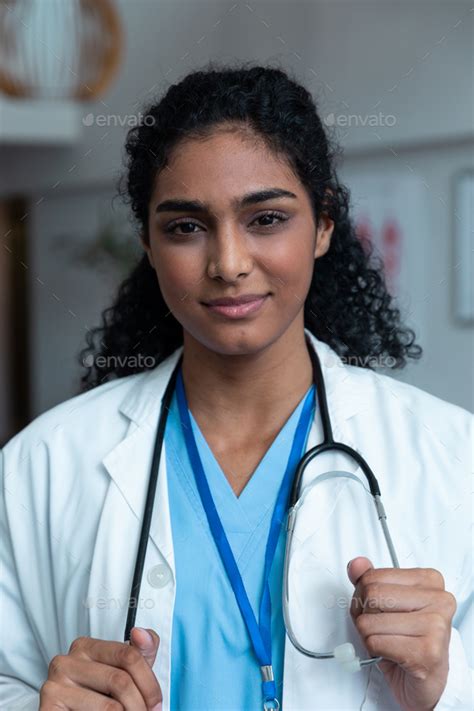 Portrait Of Smiling Mixed Race Female Doctor With Stethoscope Wearing