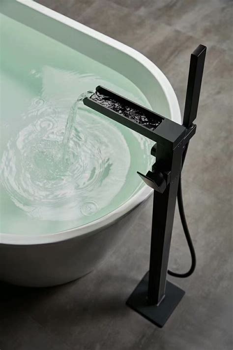 China Matt Black Waterfall Freestanding Bath Mixer Tap And Handheld