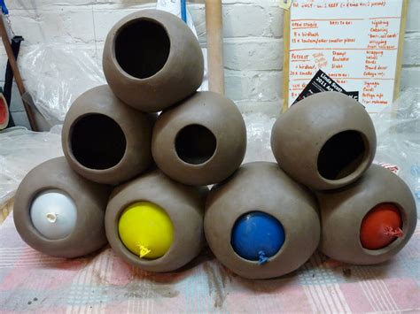 Just Pottering: Aquarium caves begin to take shape... Dampen fingertips in a clean bowl of water when working to keep the clay moist.