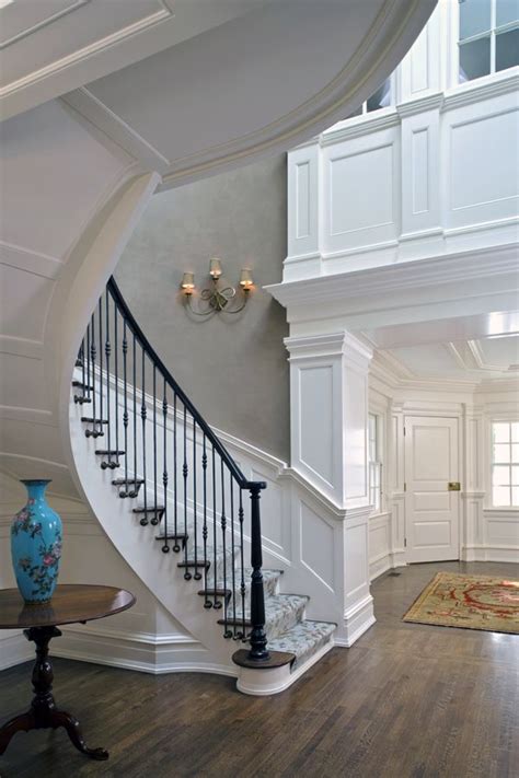 Customized Curved Floating Stair With Paneling Detail Foyer Staircase