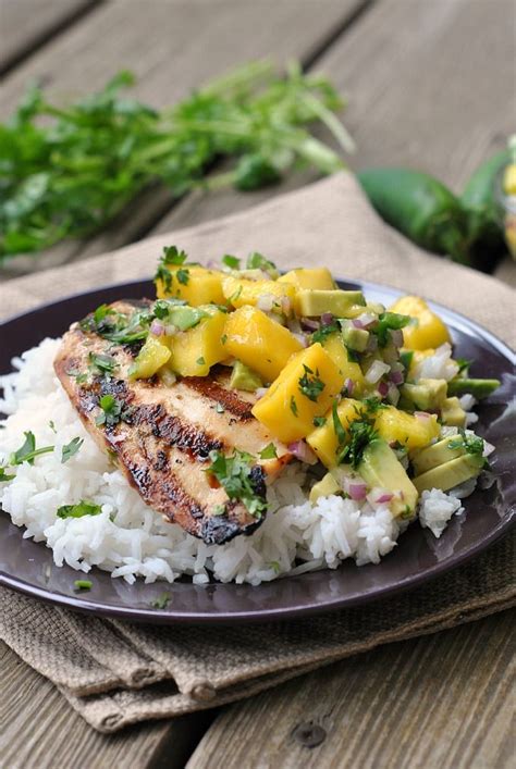 While the chicken cooks, make the avocado topping by combining the diced avocadoes with the shallots, cilantro, lime juice, and salt in a medium bowl. Cilantro-Lime Grilled Chicken with Mango-Avocado Salsa # ...