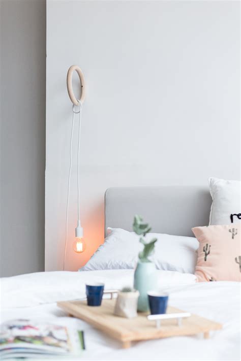 Organic and soothing, this diy pendant one was made using a hanging planter basket and sisal rope. Brighten up Bedroom Decor with a DIY Gym Ring Hanging ...