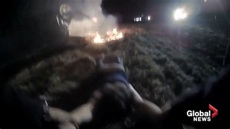 police officer rescues woman from burning car in dramatic bodycam video national globalnews ca