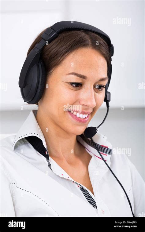 Woman With Headset In Call Center Stock Photo Alamy