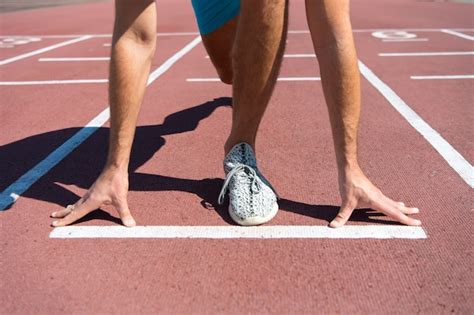 Premium Photo Leg Of Man Man Start Competition Running At Arena Track