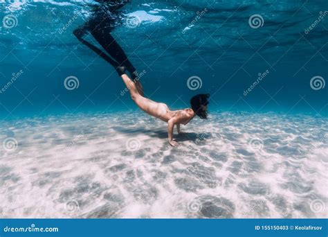 Naked Woman Free Diver Glides Over Sandy Sea With Fins Freediving In