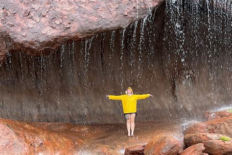 Waterfalls Cascade Down Uluru As Severe Weather Brings Heavy Rain To Nt