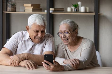 Cheerful Happy Older Married Couple Using Smartphone For Video Call Stock Image Image Of
