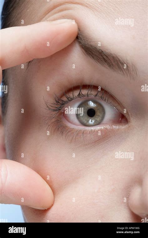 Woman Holding Her Eye Open Close Up Stock Photo Alamy