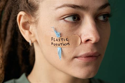 Woman With A Band Aid On Her Cheek Saying Plastic Pollution · Free