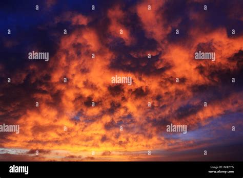 Clouds in sunset with fire color. Dramatic sunset like fire in the sky