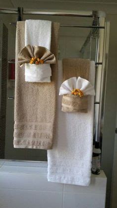 Using two drapery tassels, secure two towels over towel more inexpensive bathroom decorating ideas. DIY Decorative Bath Towel Storage Inspiration : using two ...
