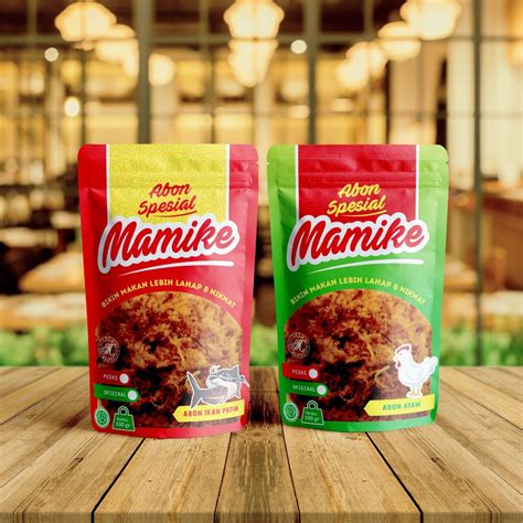 Two Bags Of Mamike Sitting On Top Of A Wooden Table Next To Each Other