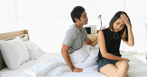 Asian Couple Having Problem In Bed And Frustrated Couple With Serious