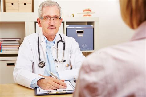 Doctor With Patient During Consultation Stock Photo Image Of