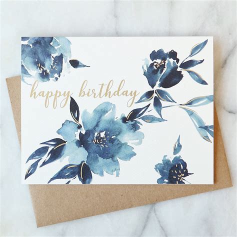 A Birthday Card With Blue Flowers On It