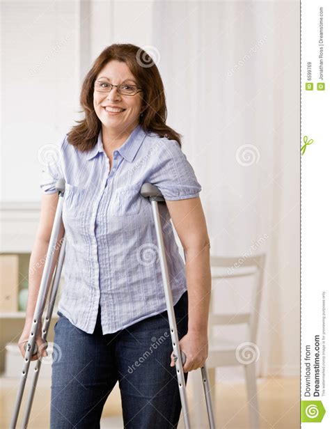 Injured Woman Using Crutches To Walk Royalty Free Stock