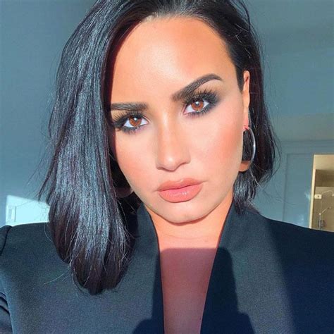 All the colour is reserved for demi's hair which is cut in long layers and styled in amazing loose waves reaching down almost to her waist. Bob Demi Lovato Short Haircut