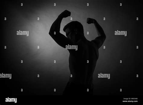 Silhouette Flexing Hi Res Stock Photography And Images Alamy