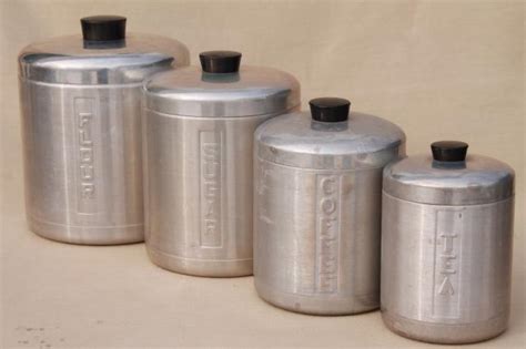 These country kitchen canisters sets are all so pretty. vintage spun aluminum canisters, mid-century retro kitchen ...