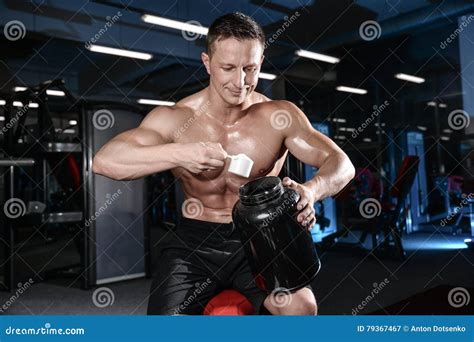 Handsome Athletic Fitness Man Posing And Trains In The Gym Stock Image