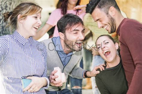 Group Of Friends Laughing Together In Underground Metropolitan Station