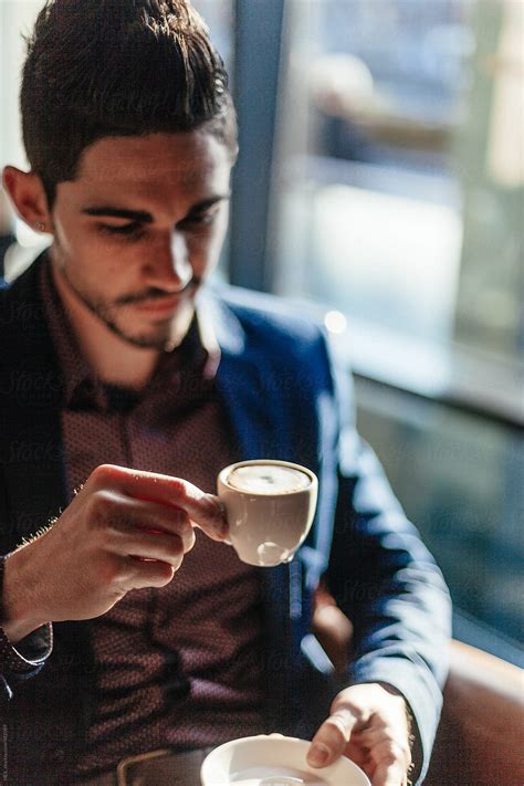 Young Businessman Drinking Coffee By Stocksy Contributor Mattia