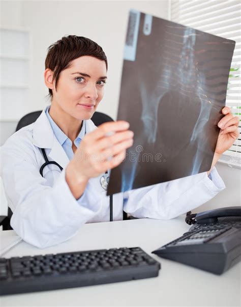 Serious Female Doctor Holding A Set Of X Ray Stock Photo Image Of