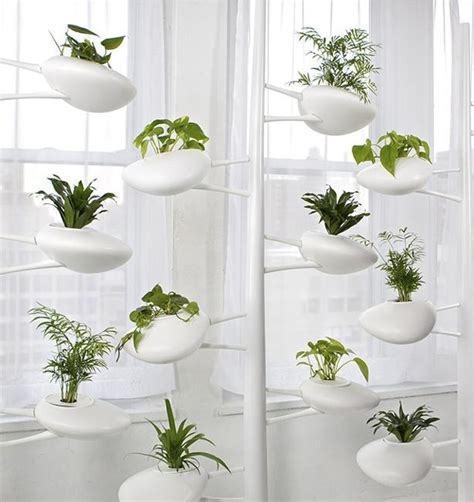 Hydroponics definition is an innovative method to grow plants without the use of soil. Hydroponic Planter Holders from Danielle Trofe Adding Green Accents to Modern Interior Design