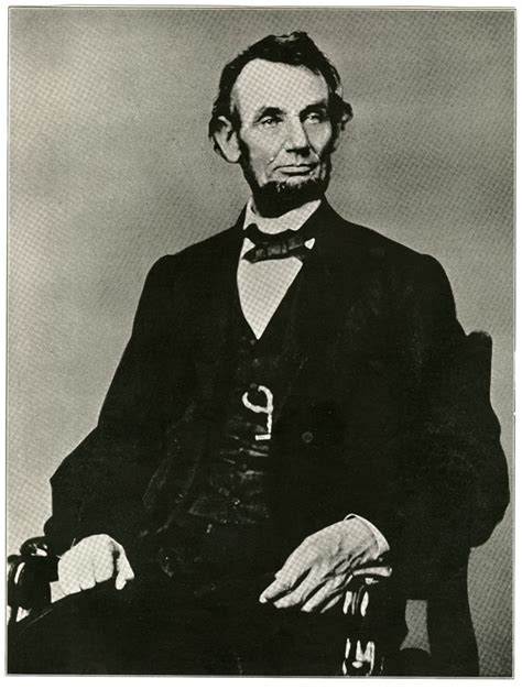 An Old Black And White Photo Of Abraham Lincoln Sitting In A Chair With