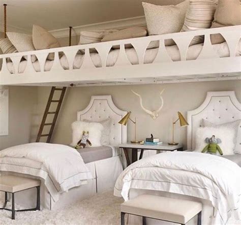 A Bedroom With Bunk Beds And White Furniture