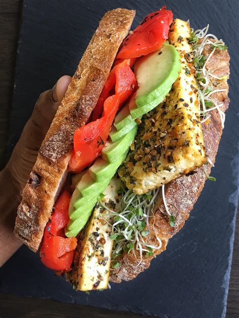Garlic And Herb Baked Tofu Sandwich With Avocado And Roasted Red Pepper