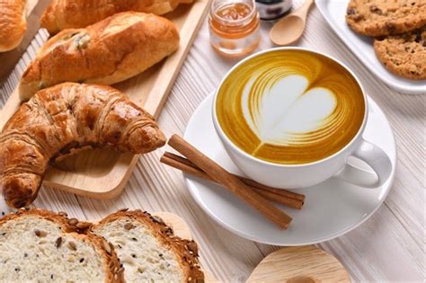Premium Photo Top View Of Cup Of Coffee With Breads Or Bun Croissant