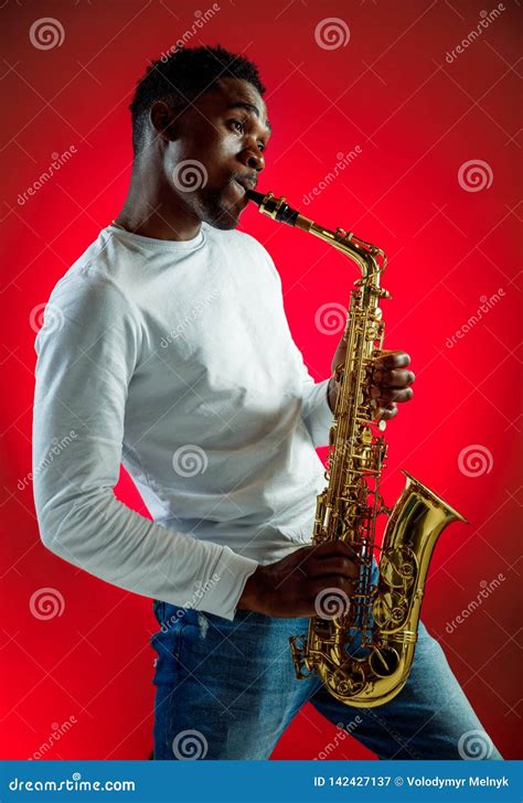 African American Jazz Musician Playing The Saxophone Stock Image